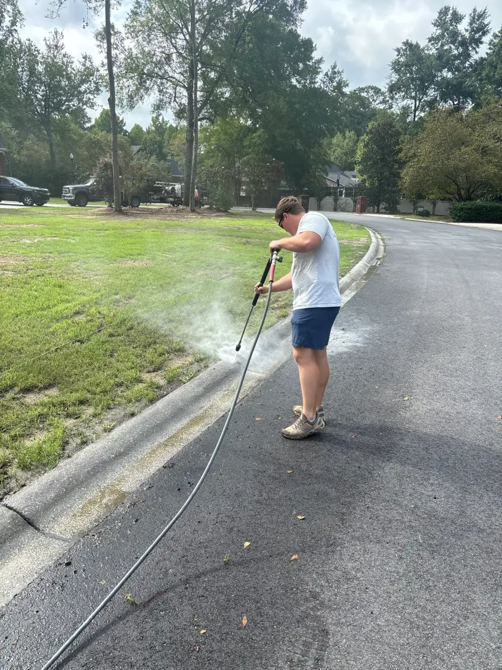 Lawson’s crew cleaning a residential curb